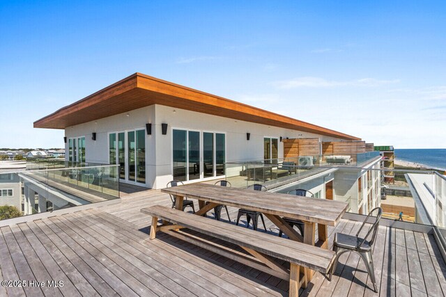 1800 Canal Dr Unit 401, Carolina Beach, NC 28428 - wooden terrace featuring a water view and outdoor dining space