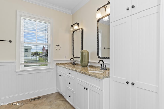 1113 Ocean Dr, Emerald Isle, NC 28594 - full bathroom featuring plenty of natural light, visible vents, wainscoting, a sink, and ornamental molding