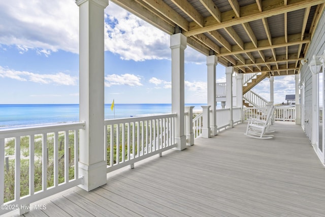 1113 Ocean Dr, Emerald Isle, NC 28594 - wooden deck with stairs, a water view, and a view of the beach