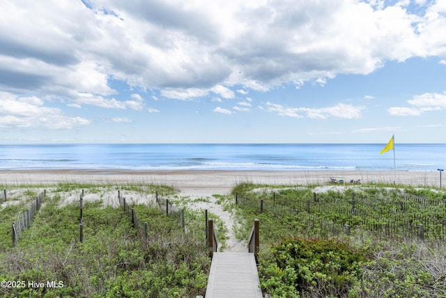 1113 Ocean Dr, Emerald Isle, NC 28594 - property view of water with a view of the beach and fence