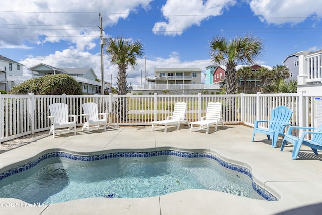 1113 Ocean Dr, Emerald Isle, NC 28594 - view of swimming pool featuring a fenced in pool, a residential view, and a patio area