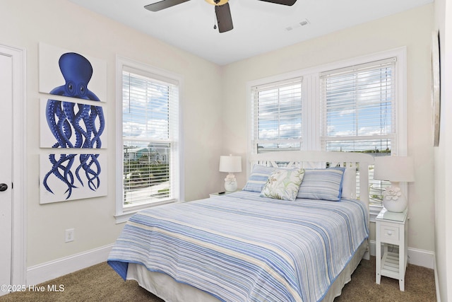 1113 Ocean Dr, Emerald Isle, NC 28594 - bedroom with baseboards, visible vents, ceiling fan, and carpet