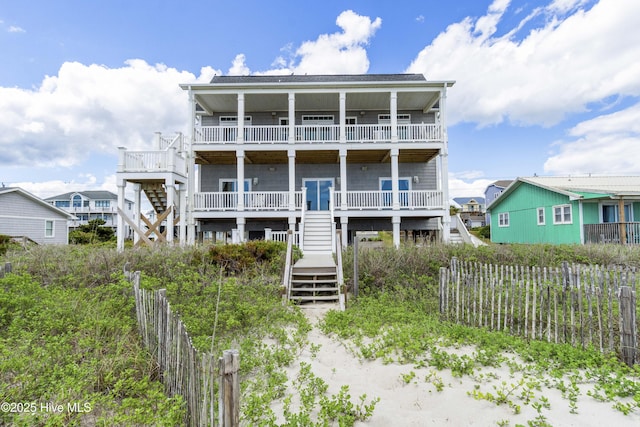 1113 Ocean Dr, Emerald Isle, NC 28594 - back of house with stairway and fence