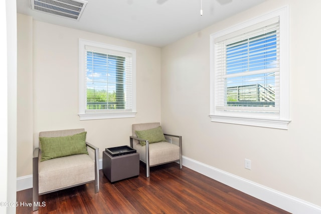 1113 Ocean Dr, Emerald Isle, NC 28594 - living area with dark wood-style flooring, baseboards, visible vents, and ceiling fan