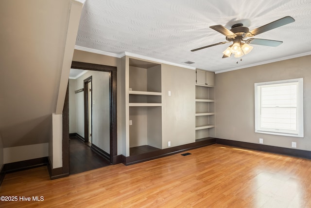 802 2nd St, Elizabeth City, NC 27909 - unfurnished bedroom with crown molding, light wood-type flooring, visible vents, and baseboards