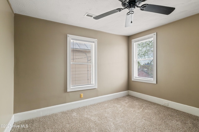 802 2nd St, Elizabeth City, NC 27909 - carpeted spare room with ceiling fan, baseboards, and visible vents