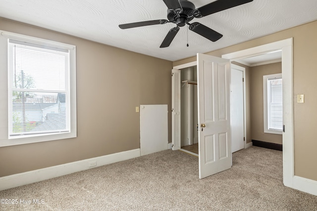 802 2nd St, Elizabeth City, NC 27909 - unfurnished bedroom featuring light colored carpet, a closet, and baseboards