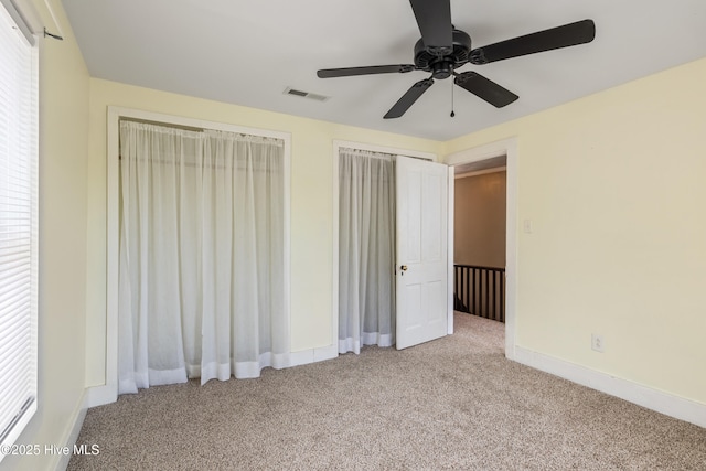 802 2nd St, Elizabeth City, NC 27909 - unfurnished bedroom with baseboards, ceiling fan, carpet flooring, and visible vents