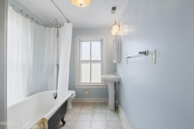 802 2nd St, Elizabeth City, NC 27909 - full bath with toilet, a sink, crown molding, visible vents, and baseboards