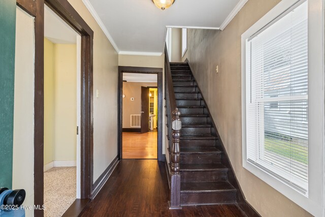 802 2nd St, Elizabeth City, NC 27909 - stairway with ornamental molding, baseboards, visible vents, and wood finished floors