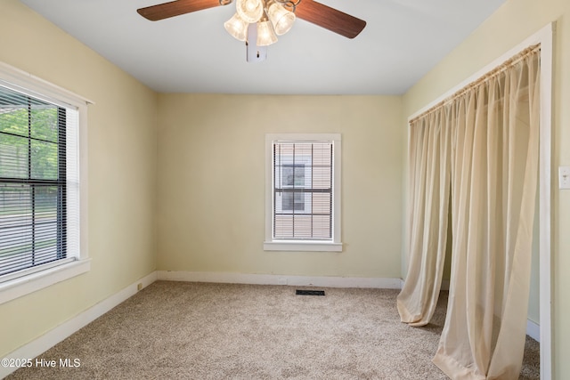 802 2nd St, Elizabeth City, NC 27909 - unfurnished room featuring baseboards, carpet floors, a ceiling fan, and visible vents