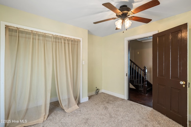 802 2nd St, Elizabeth City, NC 27909 - unfurnished bedroom with baseboards, carpet flooring, and ceiling fan