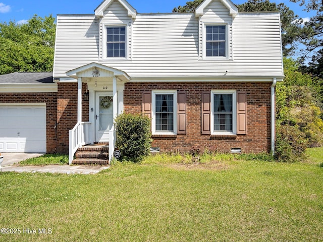 view of front of property with brick siding, a front yard, and a garage