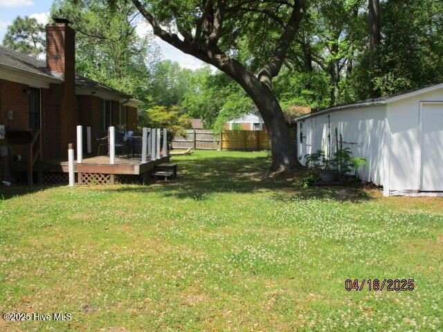 view of yard with a deck