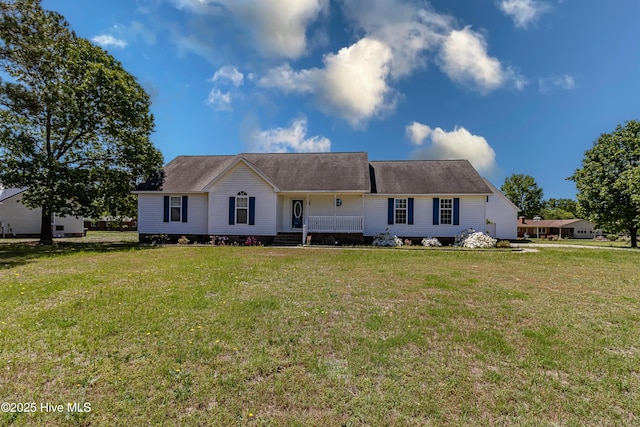 ranch-style home with covered porch and a front lawn