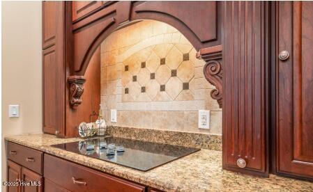 1626 Amberwood Dr SE, Bolivia, NC 28422 - interior space featuring black electric cooktop and light stone counters
