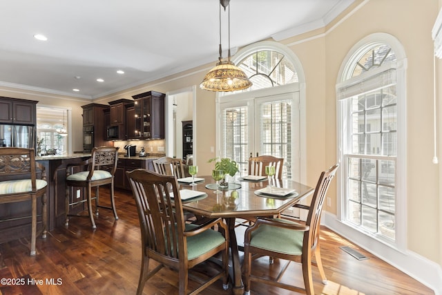 1626 Amberwood Dr SE, Bolivia, NC 28422 - dining room with recessed lighting, visible vents, crown molding, and dark wood-style floors