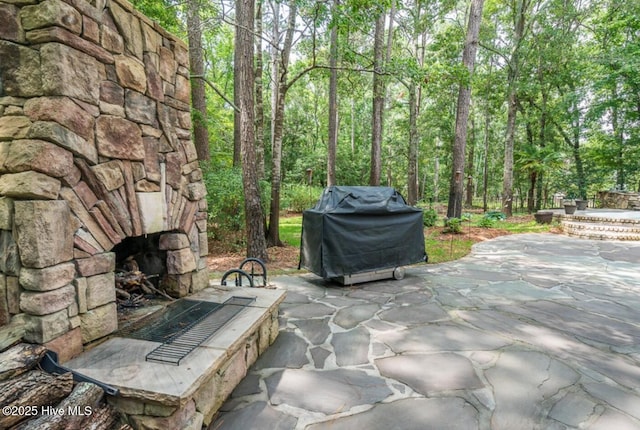 1626 Amberwood Dr SE, Bolivia, NC 28422 - view of patio / terrace featuring exterior fireplace and area for grilling
