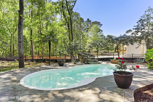 1626 Amberwood Dr SE, Bolivia, NC 28422 - view of swimming pool with a fenced in pool, a patio area, and fence