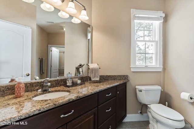 1626 Amberwood Dr SE, Bolivia, NC 28422 - bathroom featuring vanity, baseboards, toilet, tile patterned flooring, and visible vents
