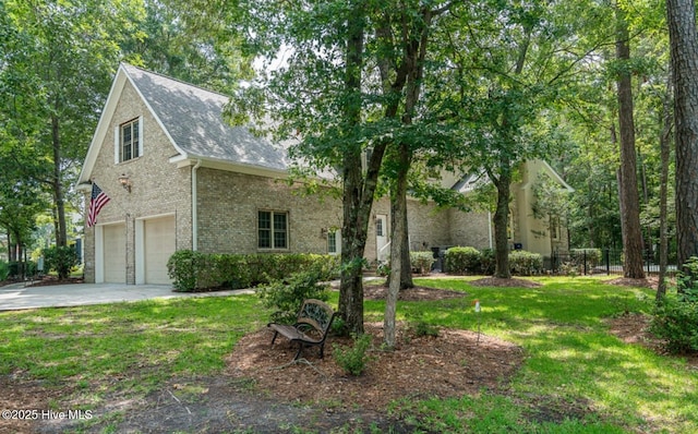 1626 Amberwood Dr SE, Bolivia, NC 28422 - view of front of home featuring a garage, concrete driveway, fence, a front yard, and roof with shingles