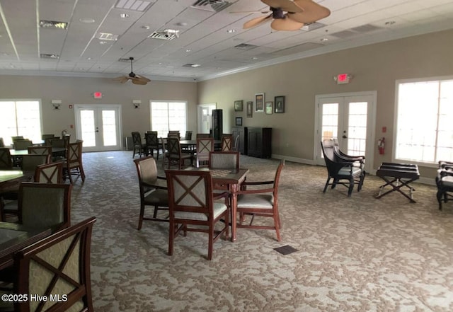 1626 Amberwood Dr SE, Bolivia, NC 28422 - carpeted dining area featuring ornamental molding, a ceiling fan, french doors, and visible vents