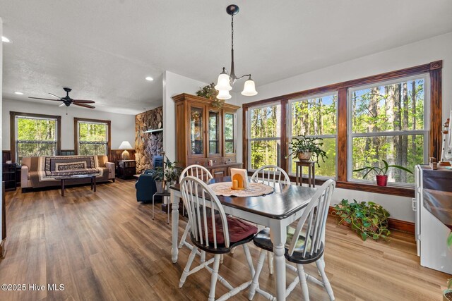 121 Pinewood Acres Dr, Powells Point, NC 27966 - dining space with baseboards, recessed lighting, light wood-style floors, and ceiling fan with notable chandelier
