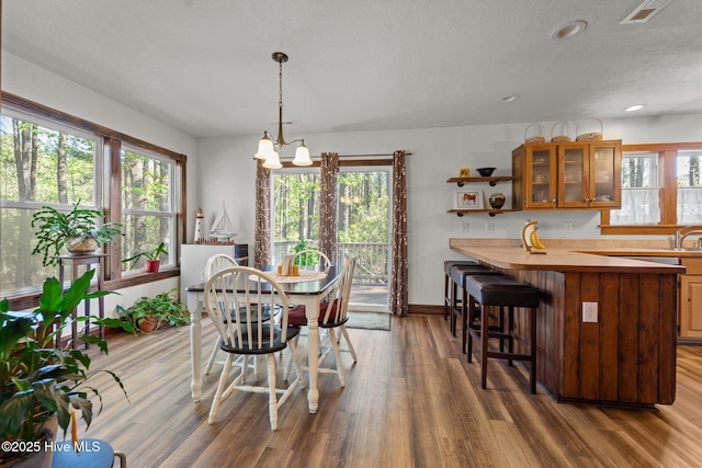 121 Pinewood Acres Dr, Powells Point, NC 27966 - dining space with wood finished floors and a wealth of natural light
