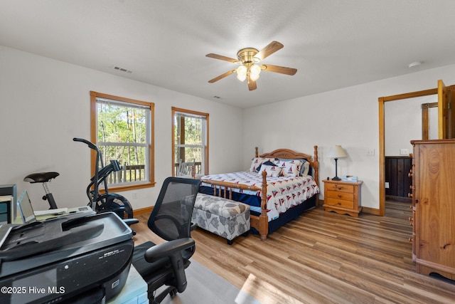 121 Pinewood Acres Dr, Powells Point, NC 27966 - bedroom with light wood finished floors, baseboards, and visible vents