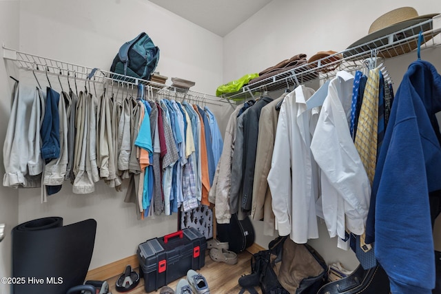 121 Pinewood Acres Dr, Powells Point, NC 27966 - walk in closet with wood finished floors