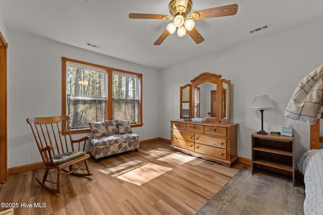 121 Pinewood Acres Dr, Powells Point, NC 27966 - sitting room with baseboards, visible vents, light wood-style floors, and ceiling fan
