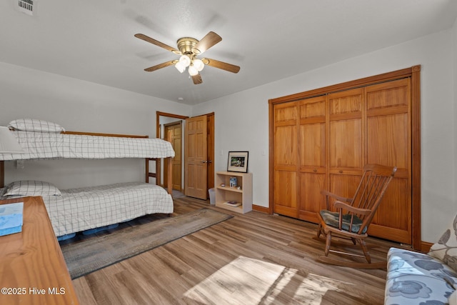 121 Pinewood Acres Dr, Powells Point, NC 27966 - bedroom with visible vents, a closet, baseboards, light wood-style flooring, and ceiling fan