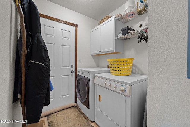 121 Pinewood Acres Dr, Powells Point, NC 27966 - washroom with washing machine and clothes dryer, a textured wall, and cabinet space