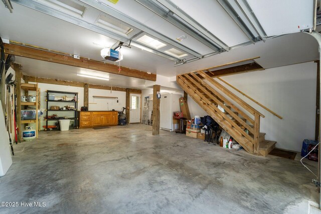 121 Pinewood Acres Dr, Powells Point, NC 27966 - garage featuring a garage door opener