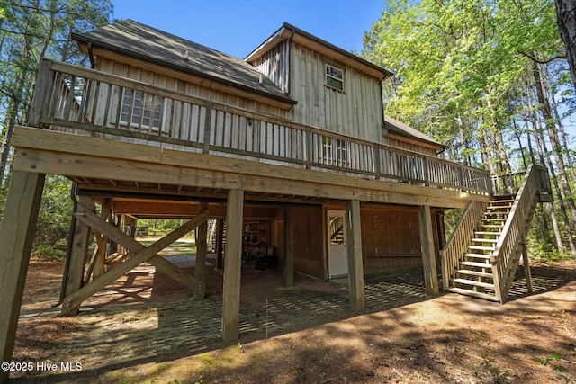 121 Pinewood Acres Dr, Powells Point, NC 27966 - view of front facade with a wooden deck and stairs