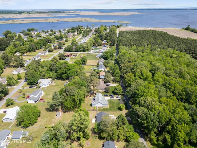 aerial view featuring a water view and a view of trees