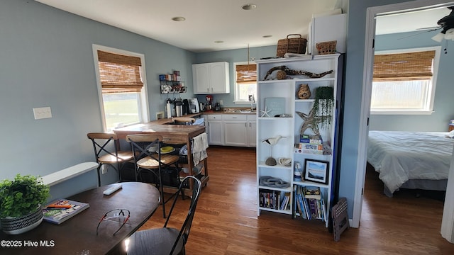 kitchen featuring open shelves, dark wood-type flooring, white cabinetry, and ceiling fan