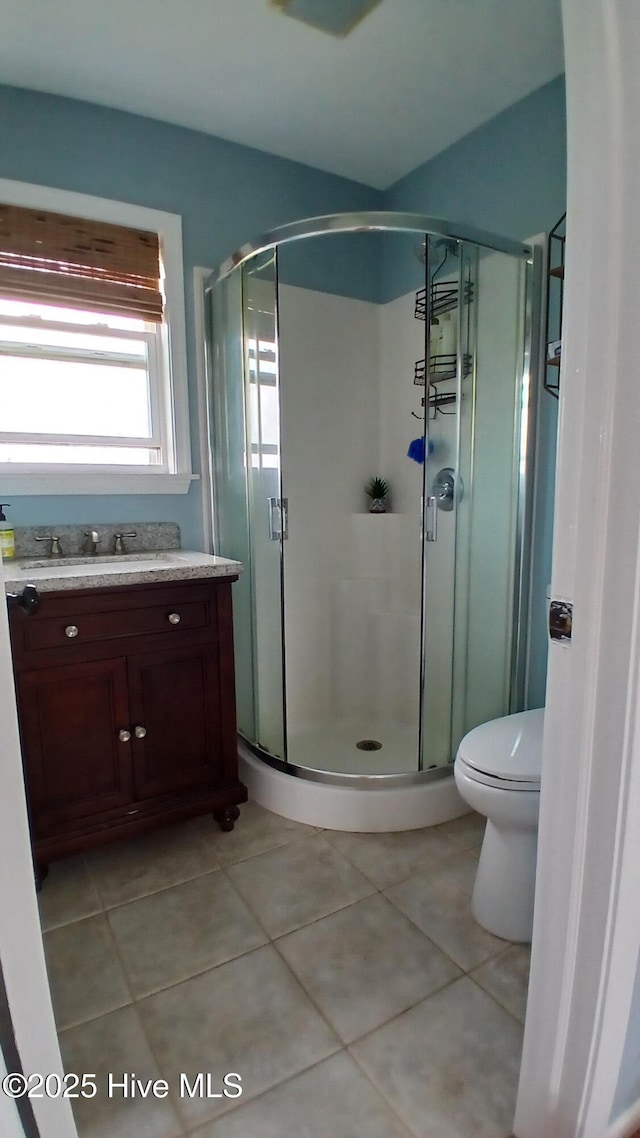 342 Owens Ln # 5, Columbia, NC 27925 - bathroom featuring tile patterned flooring, a shower stall, vanity, and toilet