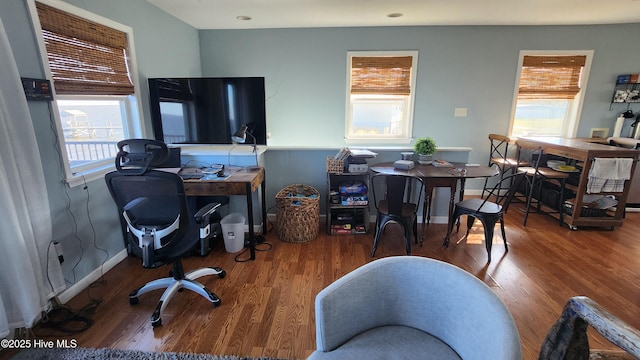 office area featuring baseboards and wood finished floors