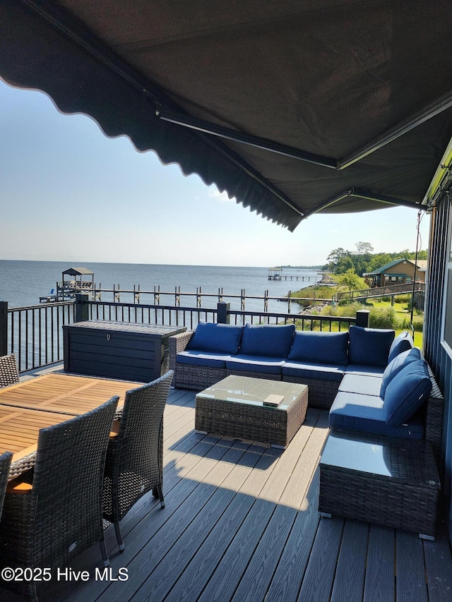 deck featuring an outdoor hangout area, outdoor dining area, and a water view