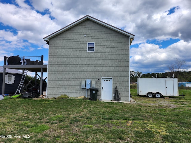 exterior space with a yard and a deck