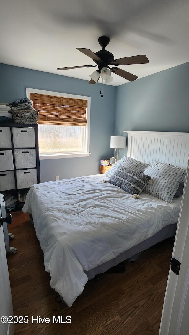 bedroom featuring a ceiling fan and wood finished floors