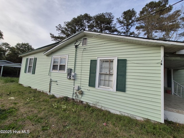 view of property exterior featuring a yard