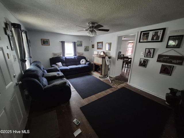 106 N Secrest St, Kinston, NC 28501 - living area with healthy amount of natural light, a textured ceiling, wood finished floors, and ceiling fan
