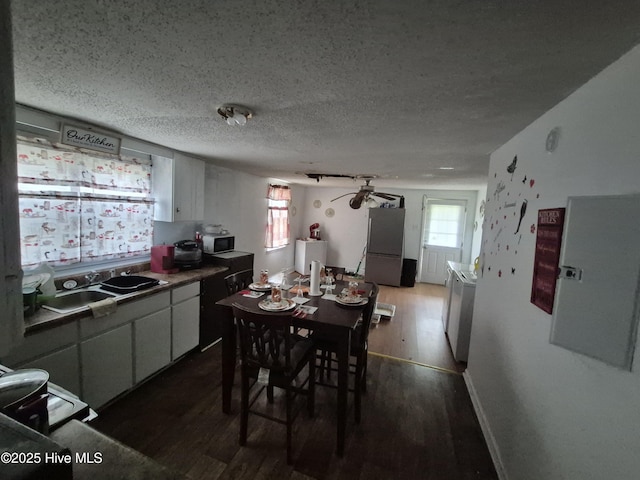 106 N Secrest St, Kinston, NC 28501 - dining area featuring wood finished floors, a textured ceiling, and a ceiling fan