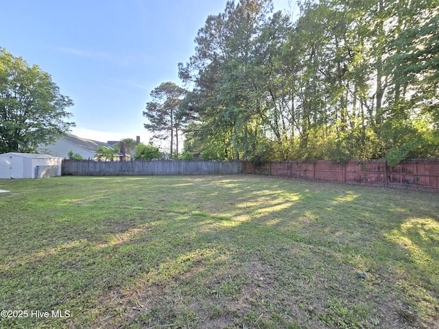 view of yard with a fenced backyard