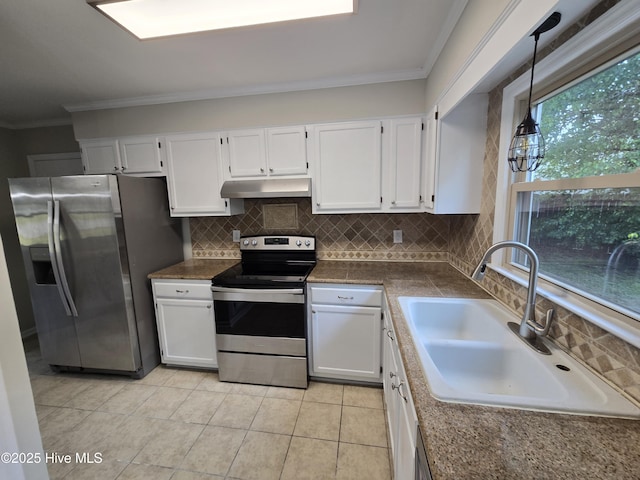 kitchen featuring crown molding, a sink, appliances with stainless steel finishes, white cabinetry, and under cabinet range hood