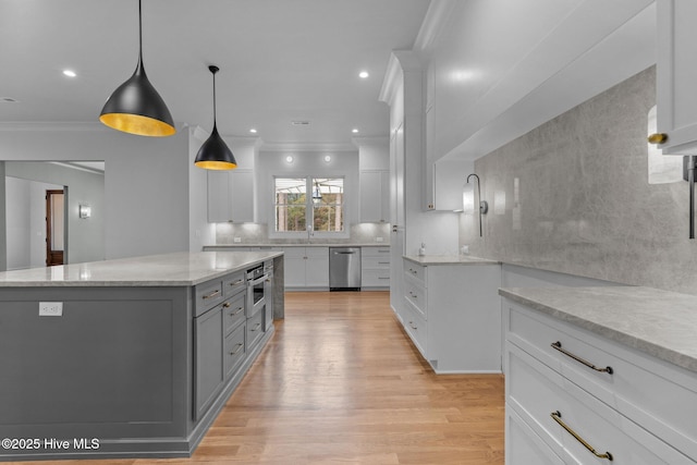 kitchen featuring crown molding, dishwasher, gray cabinetry, and tasteful backsplash