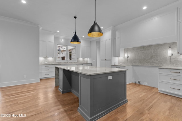 kitchen with a center island, recessed lighting, and backsplash