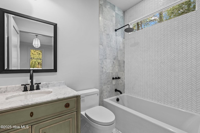 full bathroom featuring toilet, shower / bathing tub combination, and vanity